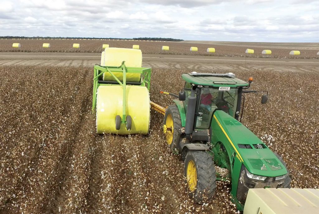 Front view of Bale Runner picking up Cotton bale